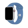Silver smartwatch with denim blue sport band and red digital crown