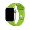 Silver smartwatch with bright green sport band and red digital crown