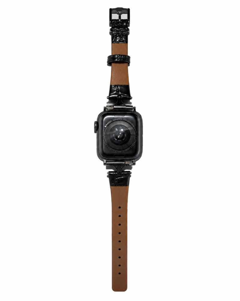 Black square smartwatch with tan leather strap and ornate hardware details