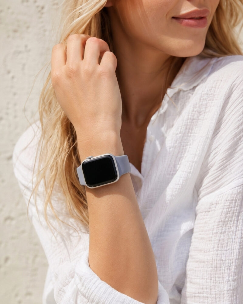 Woman wearing lavender gray sport band smartwatch on wrist