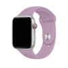 Silver Apple Watch with lavender silicone sport band and red digital crown