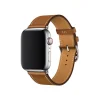 Silver smartwatch with tan leather strap and stainless steel buckle closure