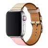 Silver smartwatch with tan leather band and pink leather strap detail