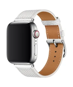 White leather Apple Watch band with tan leather interior and silver buckle