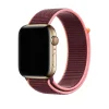 Gold Apple Watch with plum and pink sport loop band