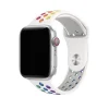 Apple Watch with white silicone sport band featuring colorful rainbow pride dot pattern