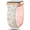 Pink floral smartwatch band with rose gold connector and black watch face