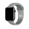 Smart watch with gray sport band and red digital crown on display