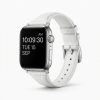 Apple Watch with white leather strap band showing time display