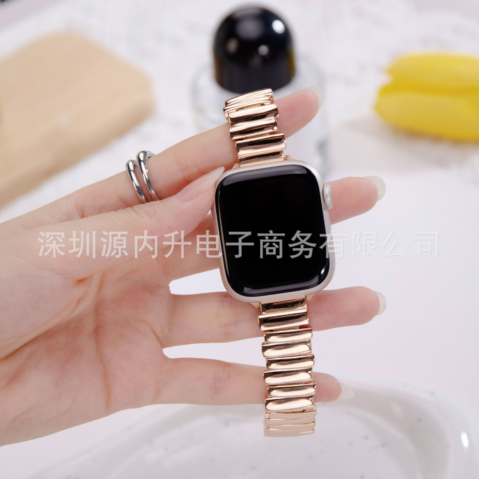 Rose gold metal strap smartwatch band with black display screen