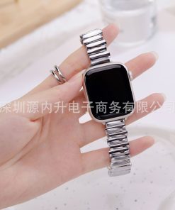 Silver metal link band smartwatch strap held in hand, closeup view