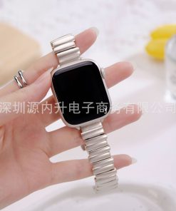 Silver metal strap smartwatch with black square display on hand