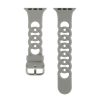 Gray silicone sport watch band with perforated design and metal buckle