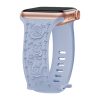 Light blue silicone smartwatch band with rose floral pattern and rose gold case