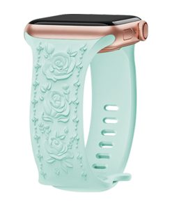 Mint green silicone smartwatch band with rose gold connector and floral design