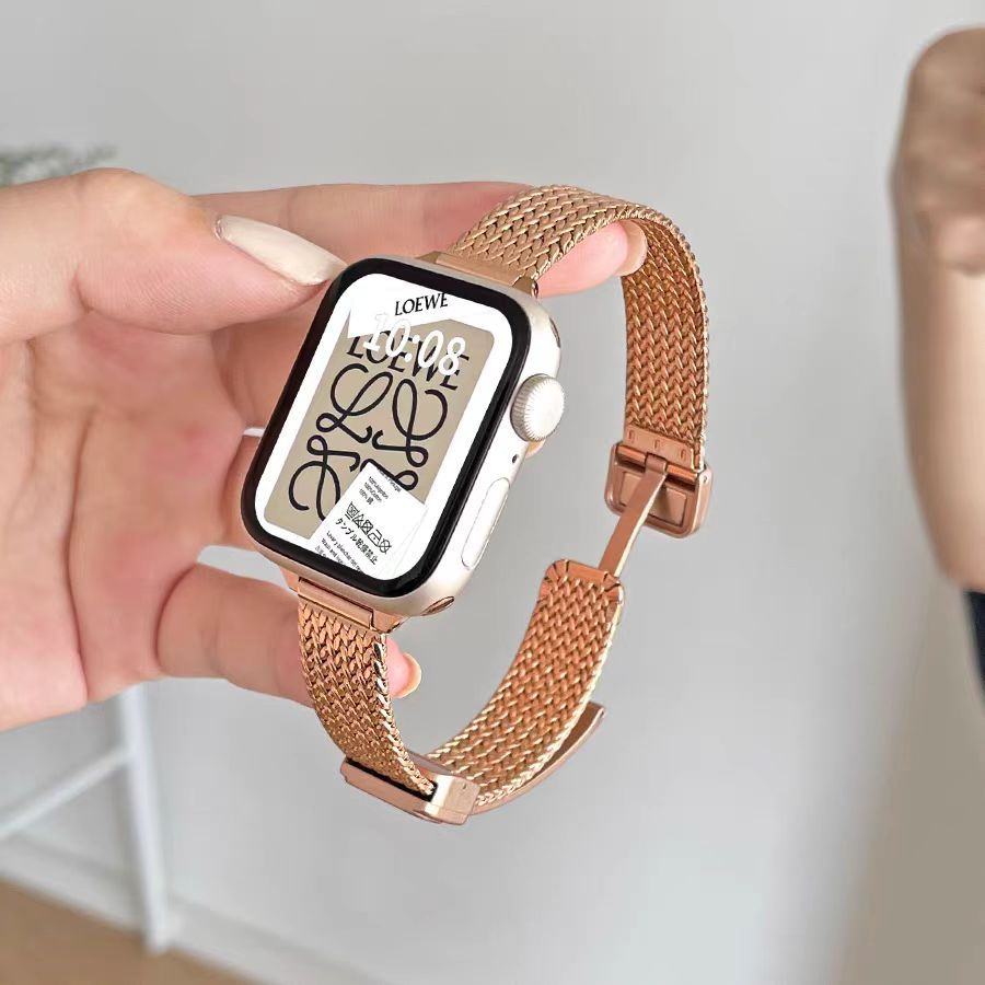 Loewe smartwatch rose gold mesh band vintage design displayed on hand