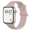 Apple Watch with pink paw print band and starlight case showing time