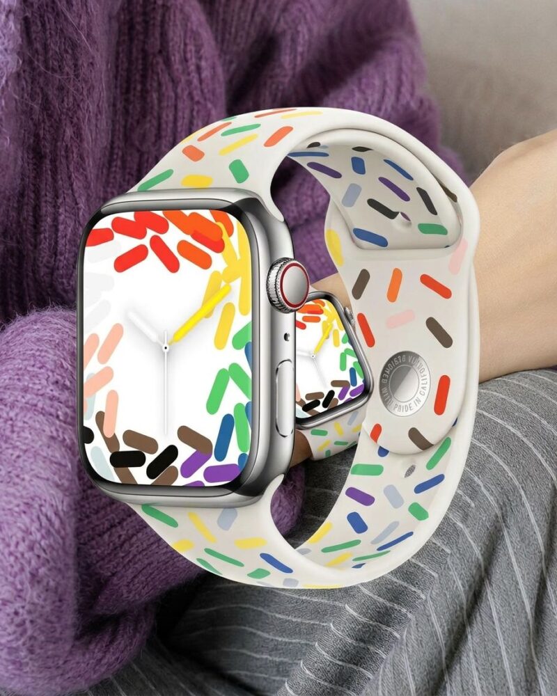 Apple Watch with colorful Pride sport band featuring rainbow confetti pattern design