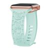 Mint green silicone smartwatch band with rose gold hardware and floral design