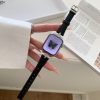 Luxury smartwatch with black leather band, crystal-embellished silver case, purple display
