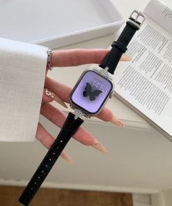 Luxury smartwatch with black leather band, crystal-embellished silver case, purple display