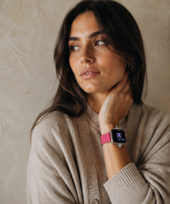 Crimson leather strap smartwatch band on woman's wrist, elegant styling