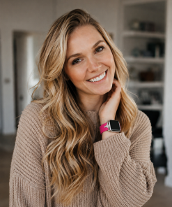 Crimson leather slim Apple Watch band worn on woman's wrist, product display