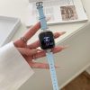 Lake blue leather Apple Watch band with silver charm detail, displayed on wrist