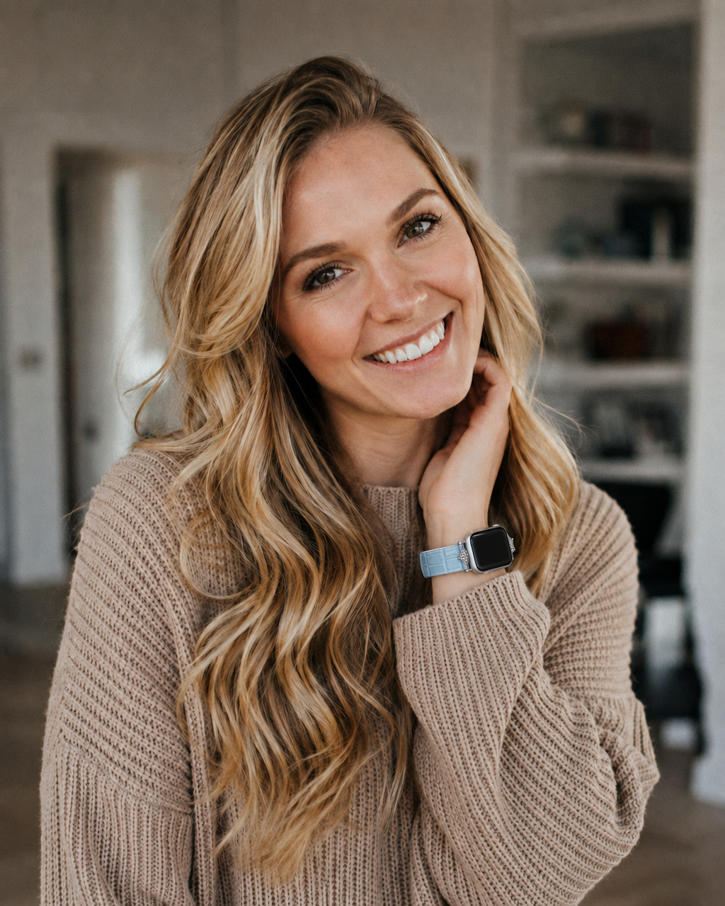 Lake blue leather Apple Watch band on woman's wrist, stylish accessory