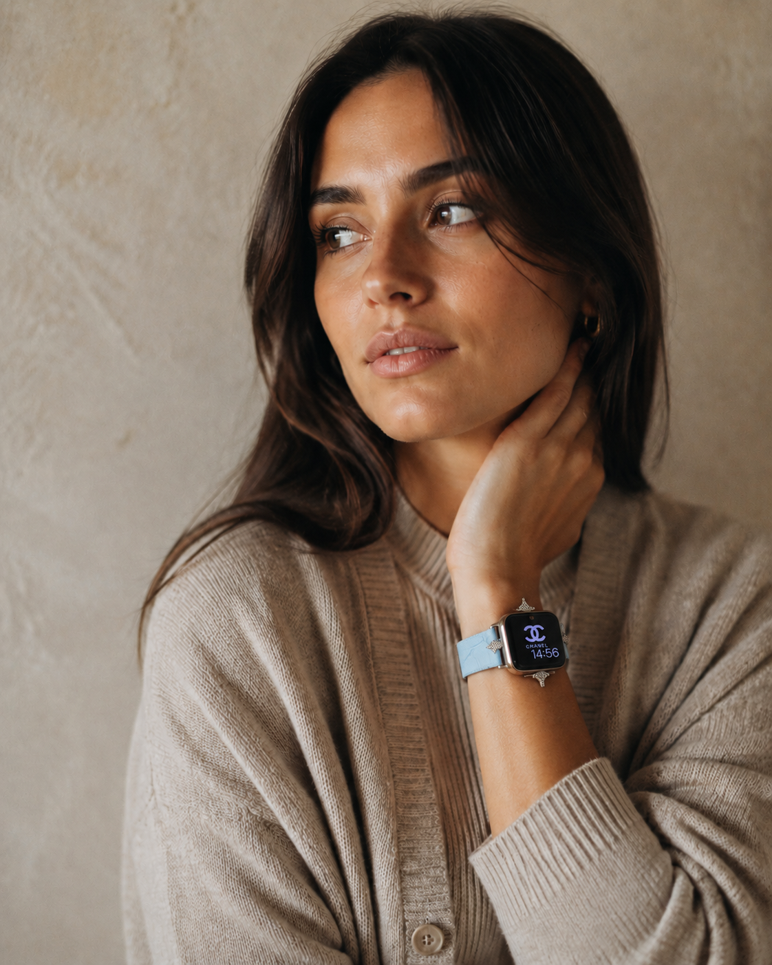 Lake blue leather Apple Watch band on woman's wrist, elegant accessory