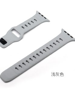 Light gray silicone sport watch band with ventilation holes and connector clasp