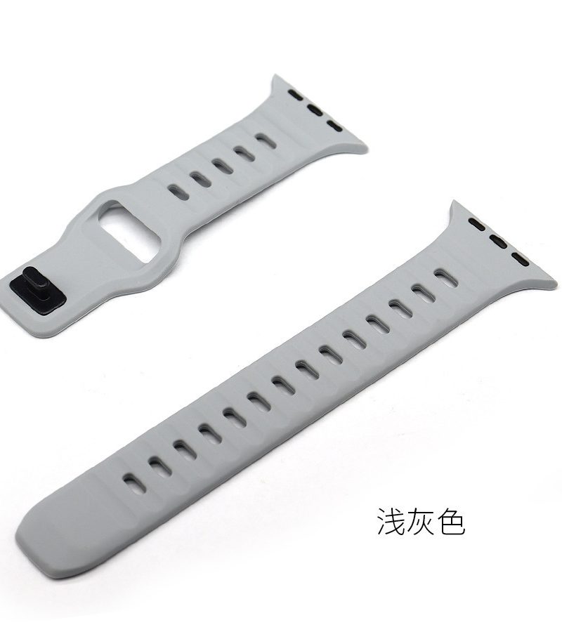 Light gray silicone sport watch band with ventilation holes and connector clasp