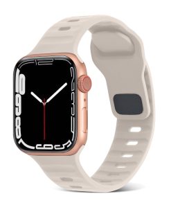 Rose gold smartwatch with cream sport silicone band and starlight dial