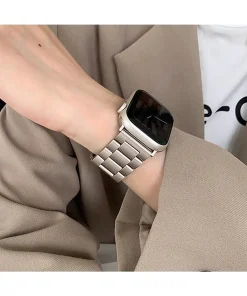 Silver stainless steel smartwatch band with square face on wrist