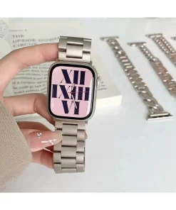 Stainless steel smartwatch with pink dial and Roman numeral display