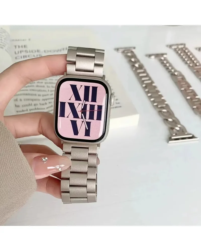 Stainless steel smartwatch with pink dial and Roman numeral display